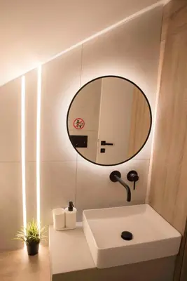 a bathroom with a white sink and a mirror at Deluxe One in Athens
