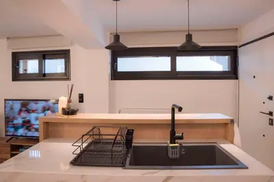 a kitchen with a sink and a counter top at Deluxe One in Athens