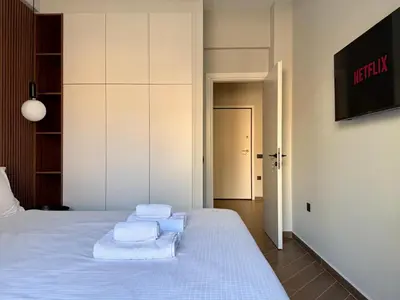 a bedroom with a bed with towels on it at A27 High-Standing One-Bedroom Apartment in Athens