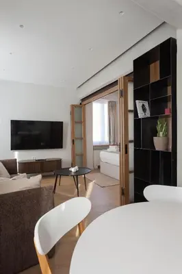 a living room with a couch and a table at Heart of Athens Suites in Athens