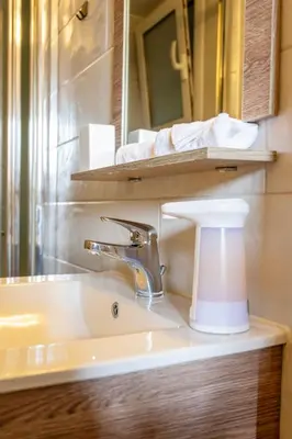 a bathroom with a sink and a mirror at Stylish 2-Bedroom Apartment with Big Terrace in Athens in Athens