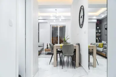 a dining room with a table and chairs at Diamond Downtown Kolonaki in Athens