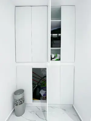 a white cabinet with a trash can in a room at Diamond Downtown Kolonaki in Athens