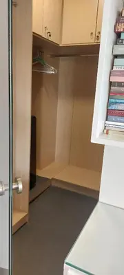 a room with a closet with books in it at Evangelia1 Comfortable room, Exquisite View in Athens