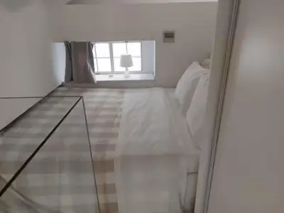 a white room with a bed and a window at Evangelia2 The 