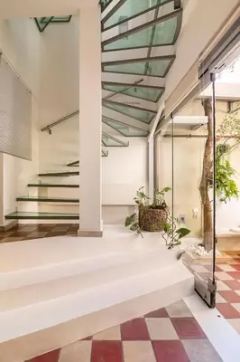 a lobby with stairs and a checkered floor at Evangelia3 Attic with Amazing View Patio in Athens