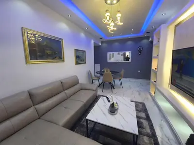 a living room with a couch and a table at Apartment fbi2 in Athens