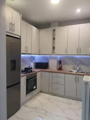 a white kitchen with white cabinets and appliances at Apartment fbi2 in Athens
