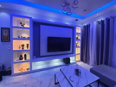 a living room with a large tv on a wall at Apartment fbi2 in Athens