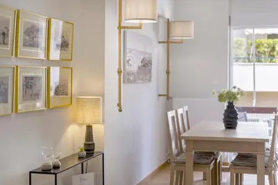 a dining room with a table and chairs at The HostMaster Timeless Elegance in Athens