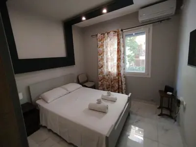 a bedroom with a bed with two towels on it at Michali's Sepolia Agios Meletis Apartment in Athens
