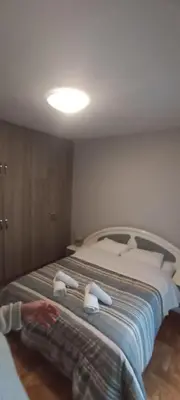 a bedroom with a large bed with towels on it at Michali's Sepolia Agios Meletis Apartment in Athens