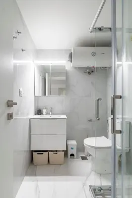a white bathroom with a sink and a toilet at Modern Gem in Central Athens in Athens