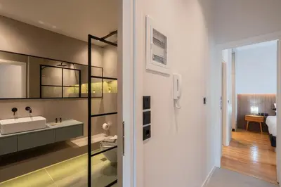 a bathroom with a sink and a mirror at LIV - Spacious Flat for Friends & Family in Athens