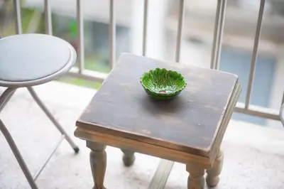 a green plant sitting on top of a wooden table at Radiant Apt near Lycabettus in Athens