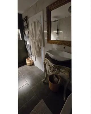 a bathroom with a sink and a mirror at Aquarius Luxury Suites in Ólimbos
