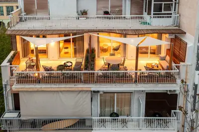 an aerial view of a building with a balcony at Aphrodite - Luxenia Suites in Athens