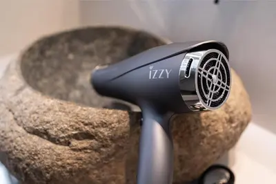 a hair dryer sitting on top of a rock at Annasa Apartments in Athens