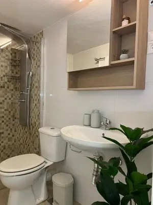 a bathroom with a toilet and a sink at Acropolis Urban sidewalk view in Athens