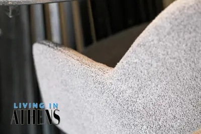 a white chair is covered in powdered sugar at Spacious Apt At Historical Center Of Athens 4&2 ppl in Athens
