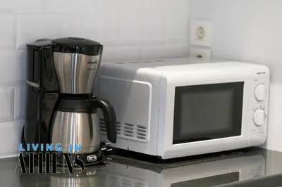 a microwave oven sitting next to a coffee maker at Spacious Apt At Historical Center Of Athens 4&2 ppl in Athens