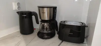 two appliances sitting next to each other on a counter at Cozy Νest Athens in Athens
