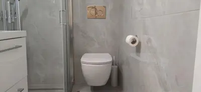 a white bathroom with a toilet and a shower at Cozy Νest Athens in Athens
