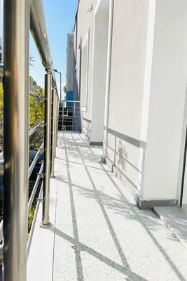 a walkway on the side of a building at Acropolis Luminous Apartment in Athens