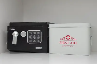 a first aid kit next to a white box at Luxury Suite 100m from Shore and Tram in Athens