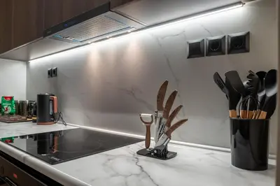 a kitchen counter with a sink and utensils at Luxury Suite 100m from Shore and Tram in Athens