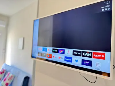 a flat screen tv hanging on a wall at Kalithea Spartis appartment in Athens