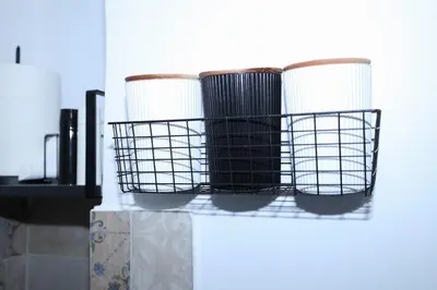 a shelf with three baskets on top of a table at steps to Lycabettus in Athens