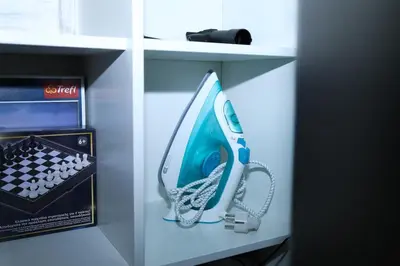 a refrigerator with a hairdryer and a remote control at steps to Lycabettus in Athens