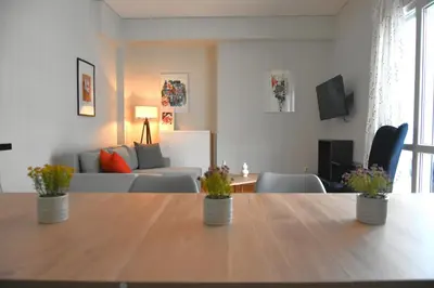 a living room with a table and a couch at Athens Quite Flat, Vibrant neighborhood & Large Balcony in Athens
