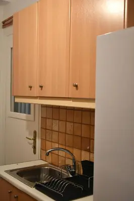 a kitchen sink with a faucet and a counter top at Athens Quite Flat, Vibrant neighborhood & Large Balcony in Athens