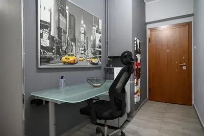 a office with a desk and a chair in a hallway at Cosy Pangrati Urban Retreat in Athens