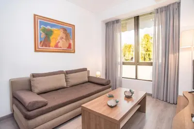 a living room with a couch and a coffee table at Beachside Bliss Central 1-Bedroom in Glyfada in Athens