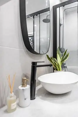 a bathroom counter with a sink and a mirror at Athenian Heaven II in Athens