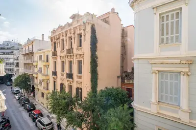 an apartment building with vines growing on the side of it at Luna Luxury Suite - close to Acropolis in Athens