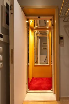 a door leading to a room with a red carpet at Acropolis Luxury Apartment in Athens