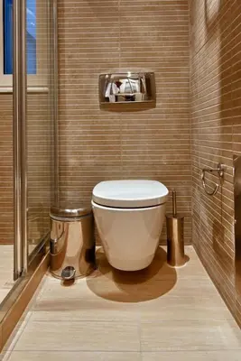 a bathroom with a toilet in the corner at Acropolis Luxury Apartment in Athens