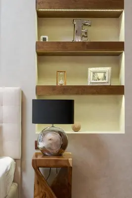 a room with a table with a lamp and shelves at Artemis - Luxenia Suites in Athens