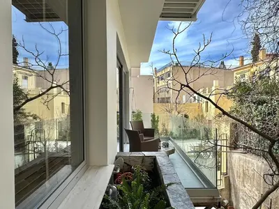 a balcony with a view of a building at Demetra-Luxenia Suites Athens in Athens