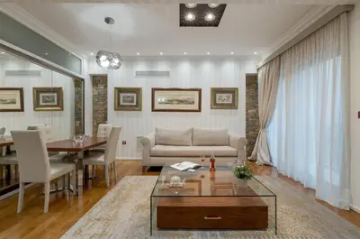 a living room with a couch and a table at Zeus - Luxenia Suites in Athens