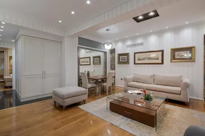 a living room with a couch and a table at Zeus - Luxenia Suites in Athens