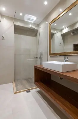 a bathroom with a sink and a shower at Zeus - Luxenia Suites in Athens