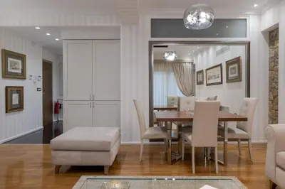 a dining room with a table and chairs at Zeus - Luxenia Suites in Athens