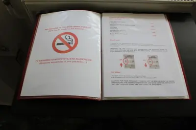an open book with a no smoking sign on it at Ionos Dragoumi 34 Athens Comfy Studio in Athens