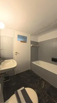a bathroom with a sink and a toilet and a tub at Ionos Dragoumi 34 Athens Comfy Studio in Athens