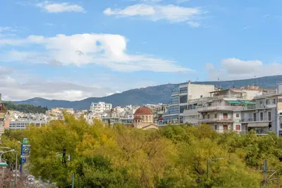 a view of a city with buildings and trees at Apollo - Luxenia Suites in Athens